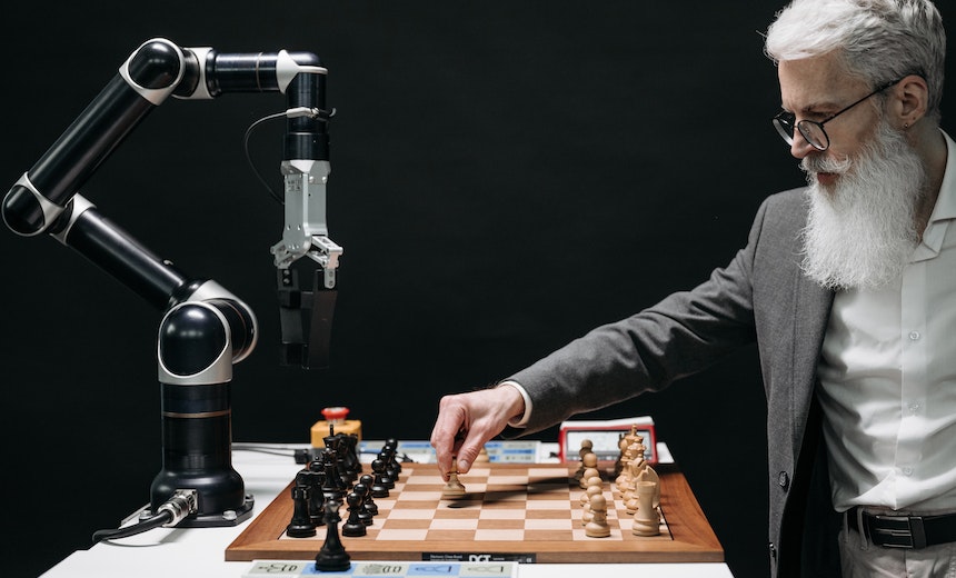 Chessboard with miniature buildings representing  and microsoft